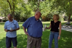 Stuart and Melanie in discussion with a distracted Todd